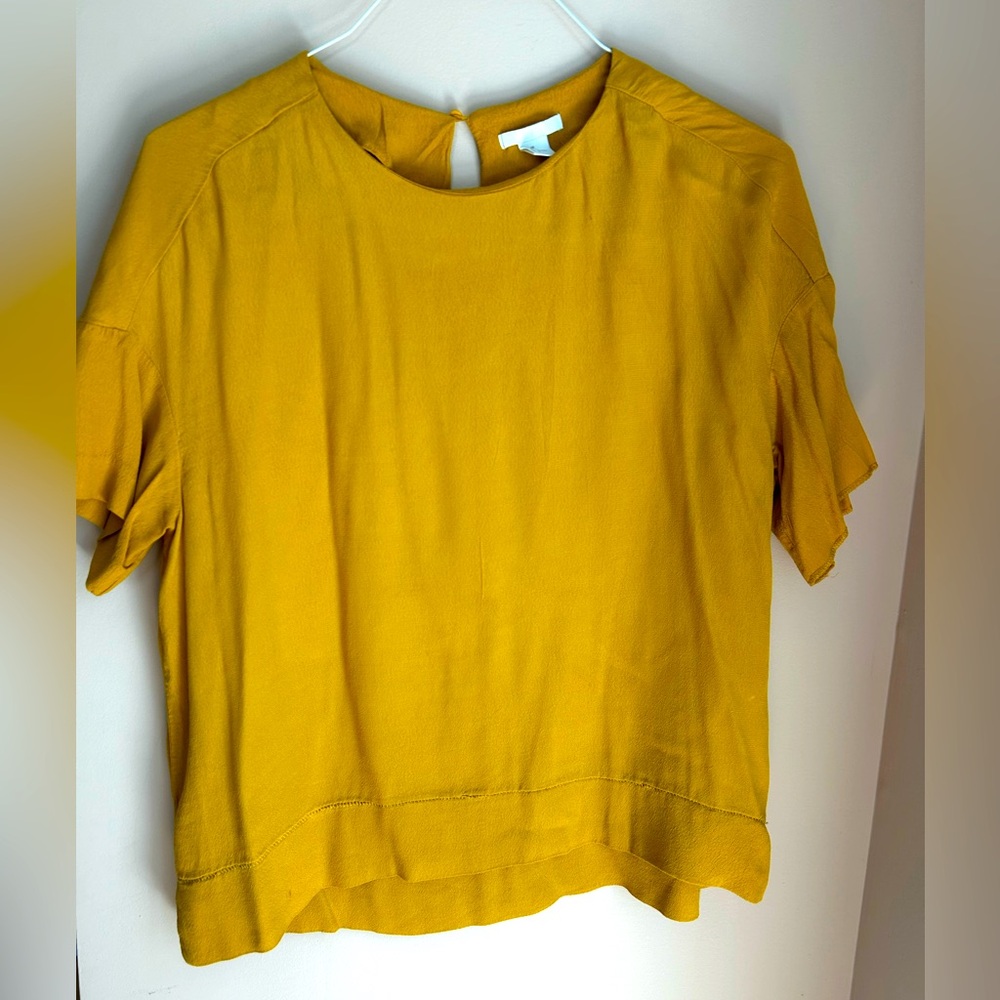 Great summer piece in mustard color and open detail.